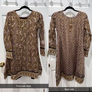 Brown dress with gold embroidery.